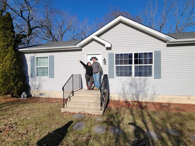 Kayla and Shane in front of house